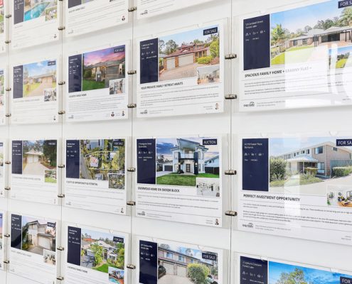 Buying a house or apartment. AP-Realty showcase wall of available properties.