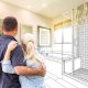 Budget-Friendly Bathroom Updates. Couple standing infront of their bathroom imagining the possibilitie sof a new make-over.